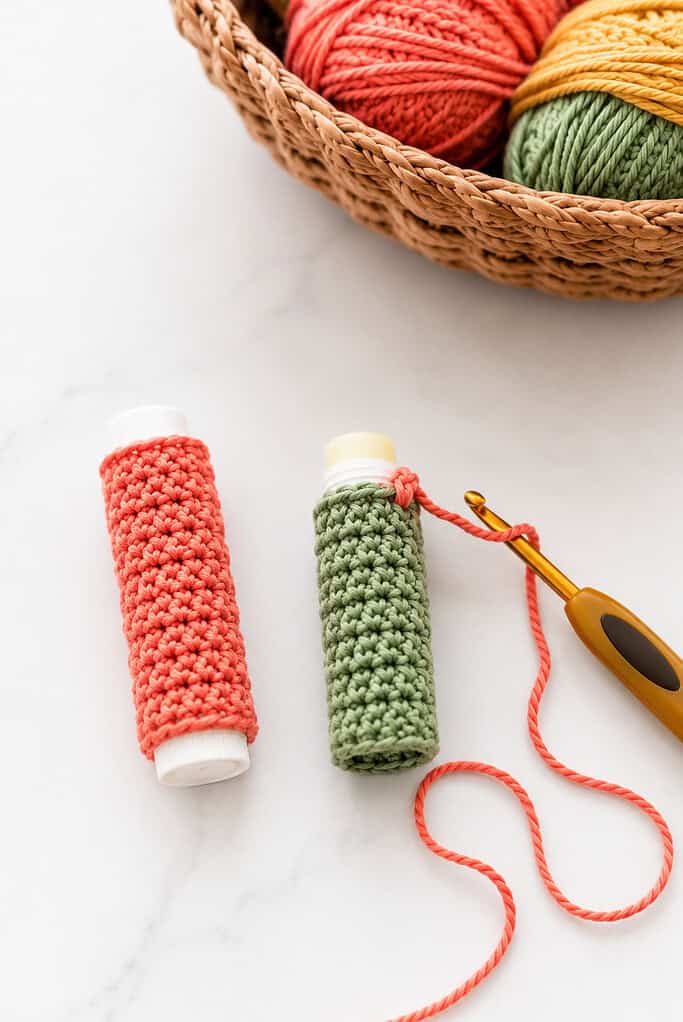 a small crocheted tube perfectly fitted around a standard lip balm stick
