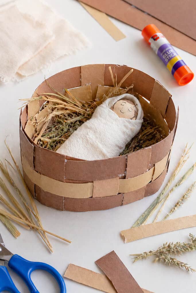 a small handmade basket created from a cardstock base with real woven paper strips