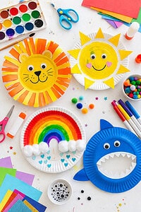 a mix of finished and in-progress crafts (e.g., a smiling animal face, a sun, a rainbow design) to add storytelling and variety