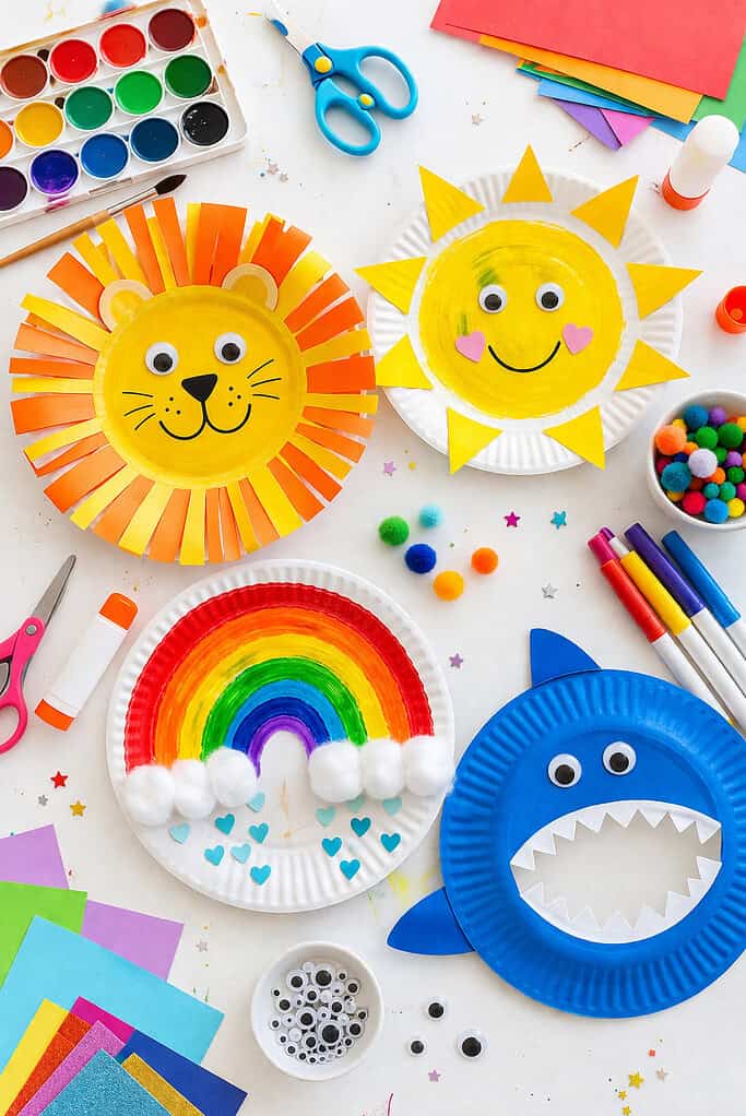 a mix of finished and in-progress crafts (e.g., a smiling animal face, a sun, a rainbow design) to add storytelling and variety