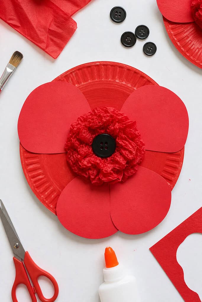 A paper plate transformed into a poppy flower.