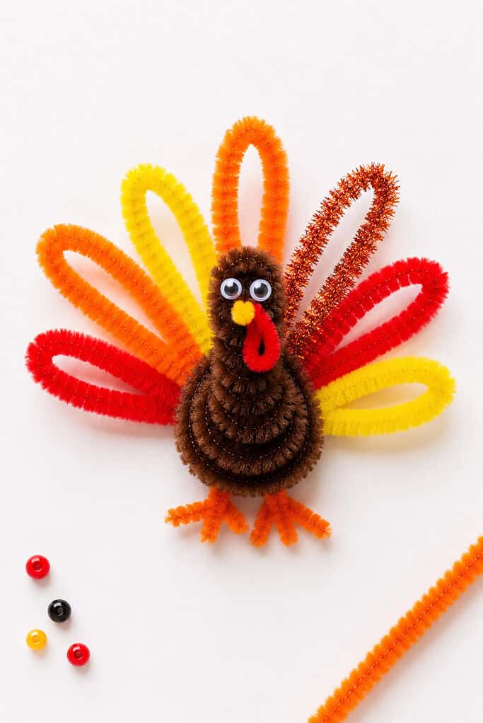 a handmade turkey crafted from fuzzy pipe cleaners