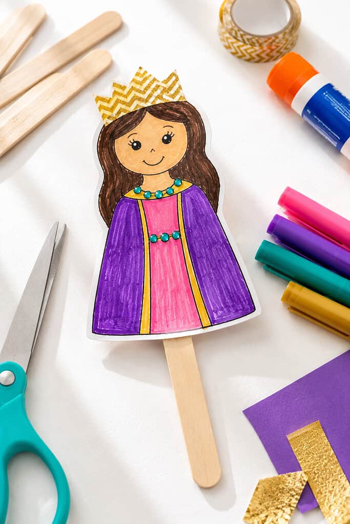 a simple handmade Queen Esther puppet attached to a wooden popsicle stick