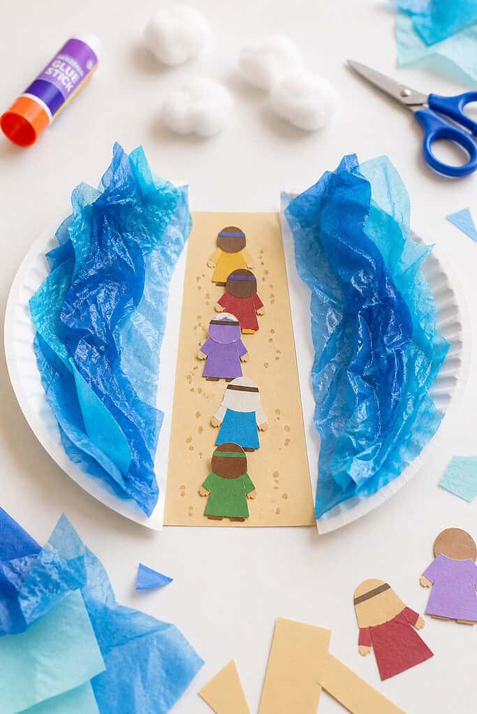 a paper plate cut cleanly in half, with the two halves positioned apart to form an open path between them