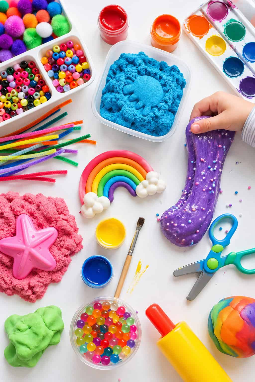 a variety of sensory craft materials in an aesthetically pleasing, slightly scattered but intentional layout