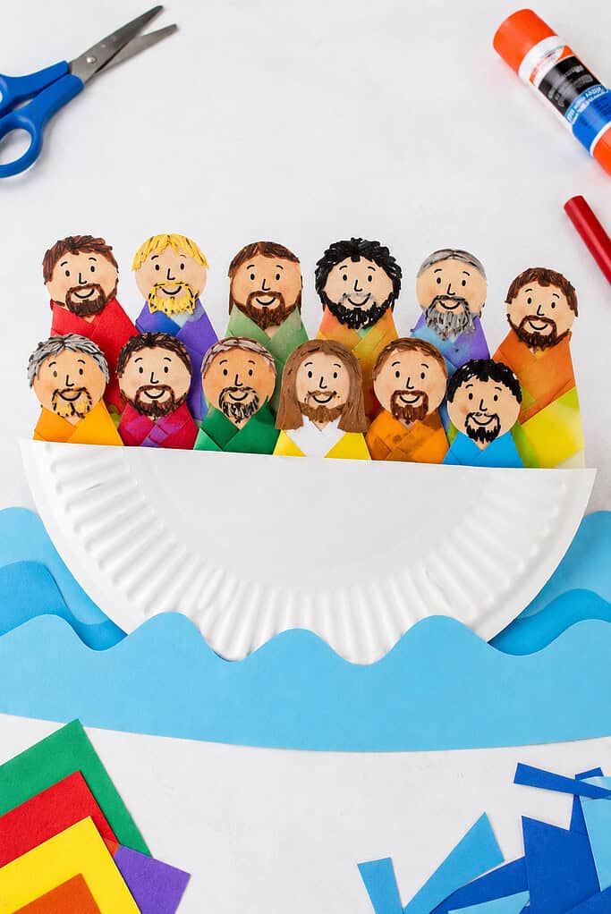 a simple white paper plate folded in half to create a small boat.