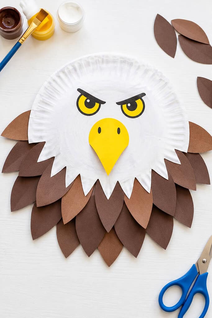 a paper plate transformed into the proud face of a bald eagle