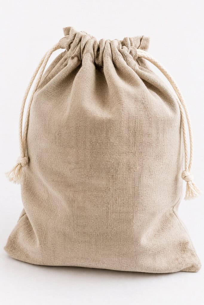 a finished handmade linen drawstring bread bag designed for storing artisan bread.