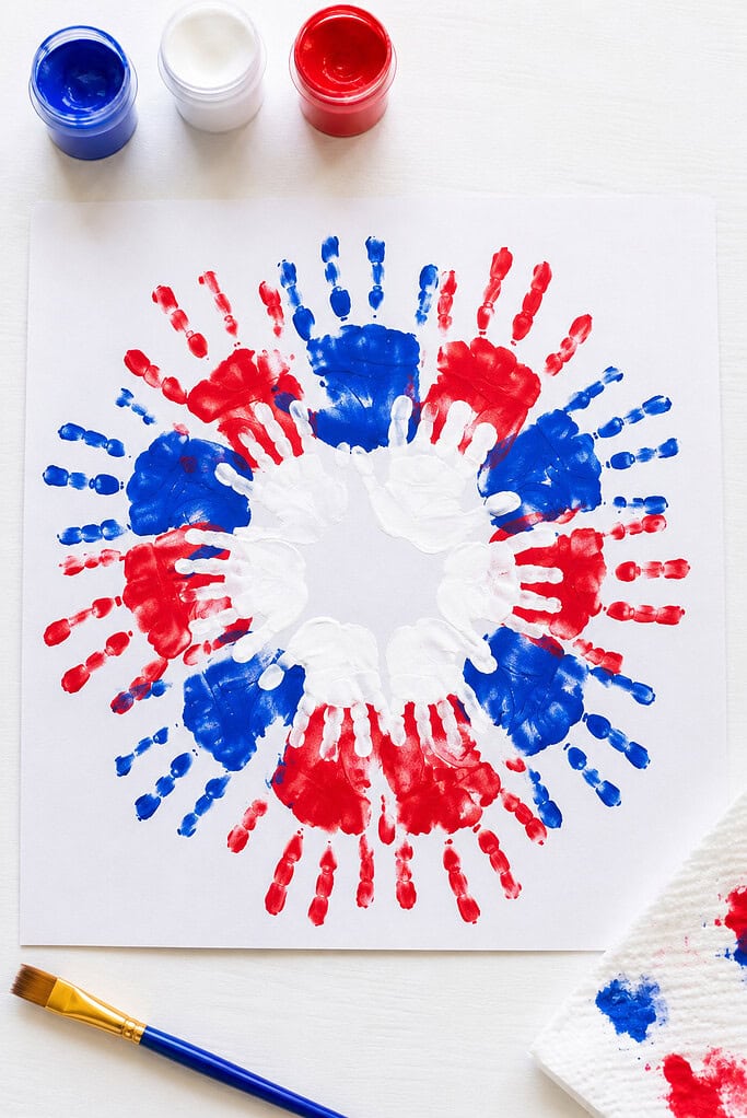 a colorful artwork created from overlapping handprints in vibrant patriotic colors