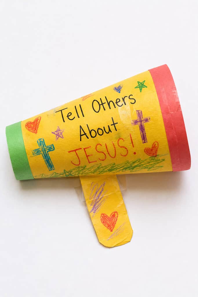 a simple handmade paper megaphone created from brightly colored construction paper rolled into a cone shape and secured with tape or glue.
