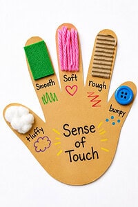 Preschool five senses hand craft with colorful textures for teaching touch, including cotton, felt, yarn, cardboard, and a button.