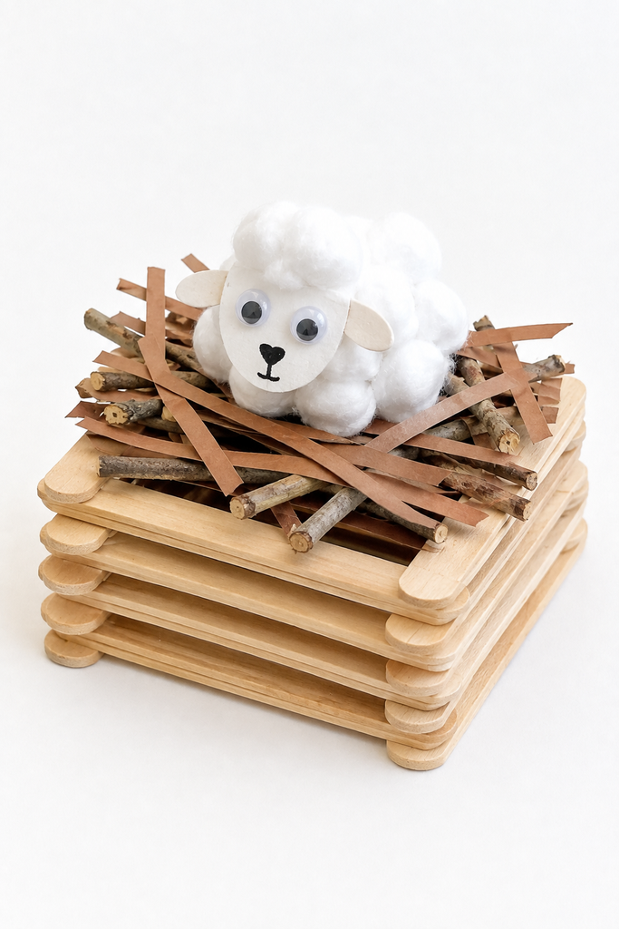A popsicle-stick altar stacked log-cabin style with twigs on top and a small cotton-ball lamb.