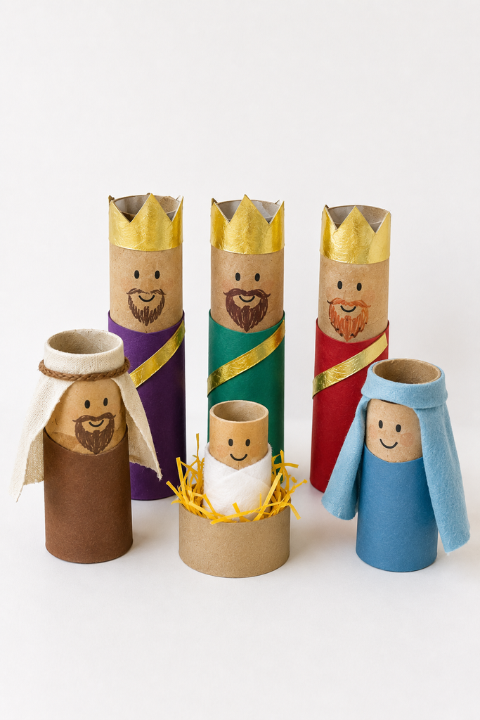 Standing brown cardboard tube nativity figures with drawn faces, cloth robes, gold foil crowns on the three kings, and cloth veils on Mary and Joseph.