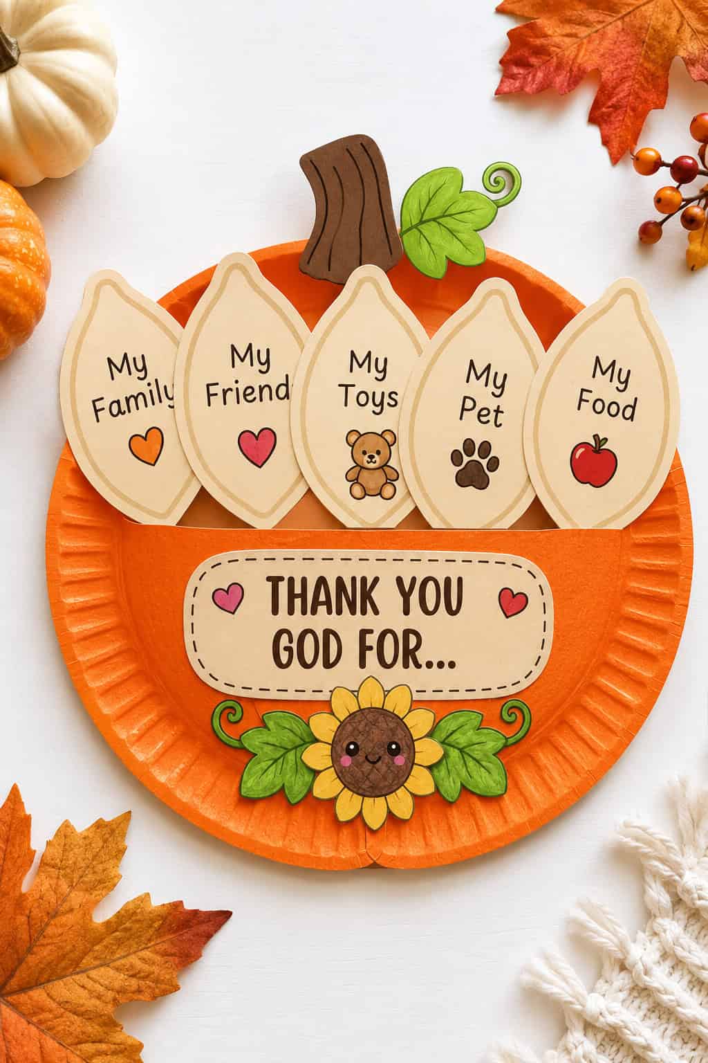 Finished paper plate pumpkin Thanksgiving Bible craft with a "Thank You God For" sign and thankful pieces fanning out of the top