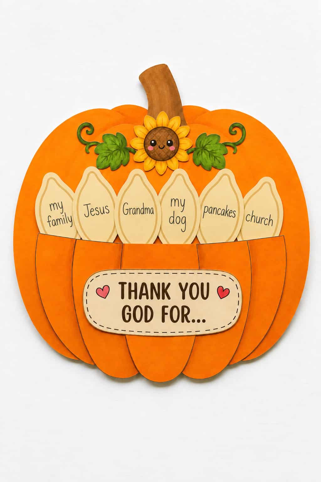 Finished Thanksgiving pumpkin Sunday school craft with a "Thank You God For" sign, a smiling sunflower, and paper pieces fanning out of the top