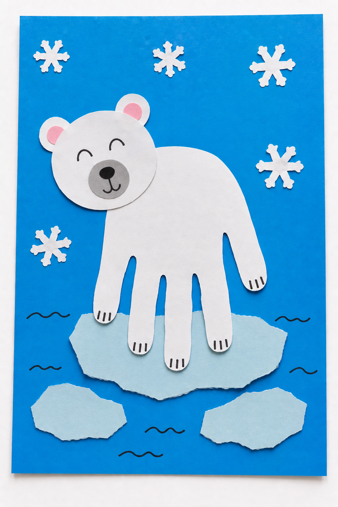 a white handprint polar bear with finger legs standing on paper ice floes with snowflakes on blue paper