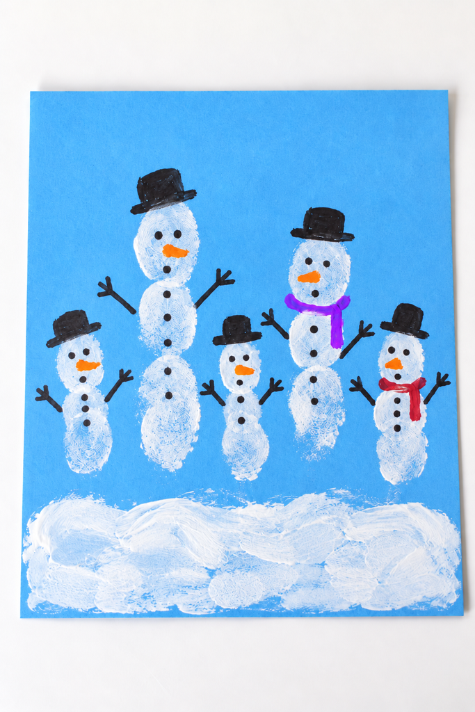 a card of small white fingerprint snowmen with drawn hats, dot eyes, orange noses, and stick arms on a white table